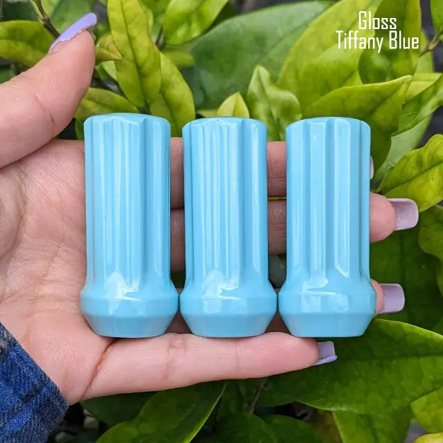 Set of 32 premium 14×1.5mm 7-spline lug nuts, each 2 inches tall, featuring durable powder-coated finish and including two custom-fit key sockets for secure, hassle-free installation. - Image 16